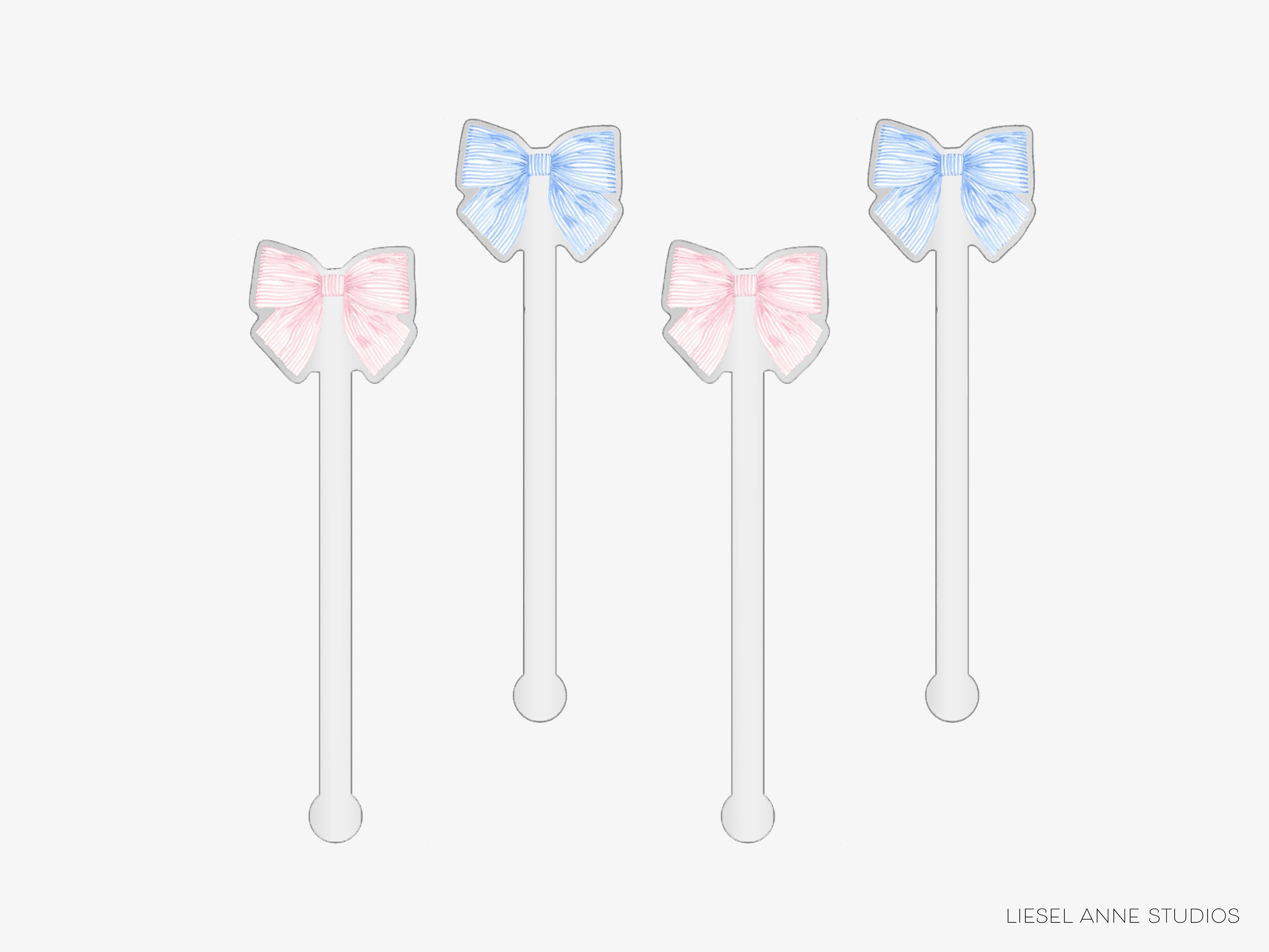 four white toothpicks with blue and pink bows on them.
