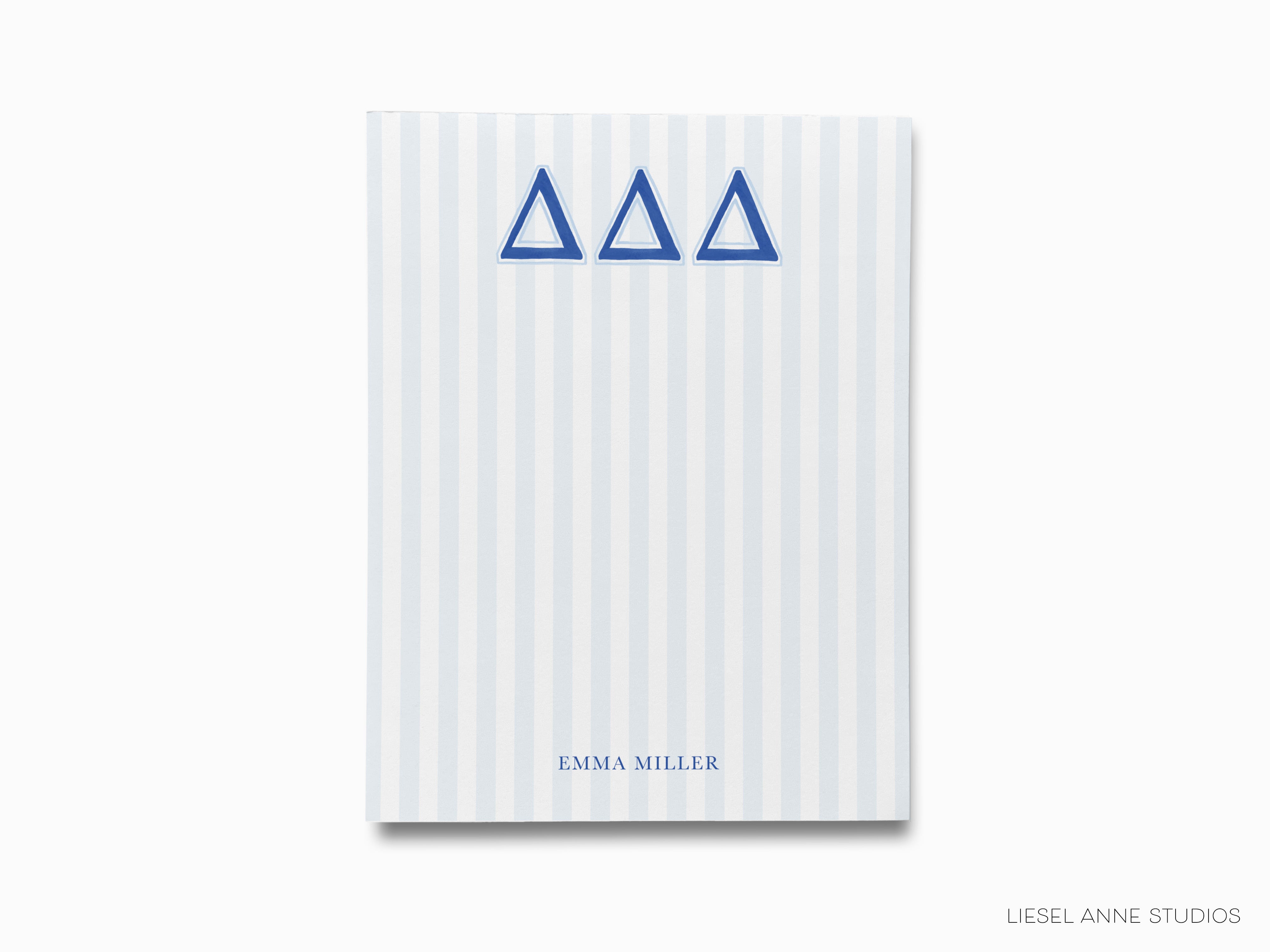 a blue and white book with a blue symbol on it