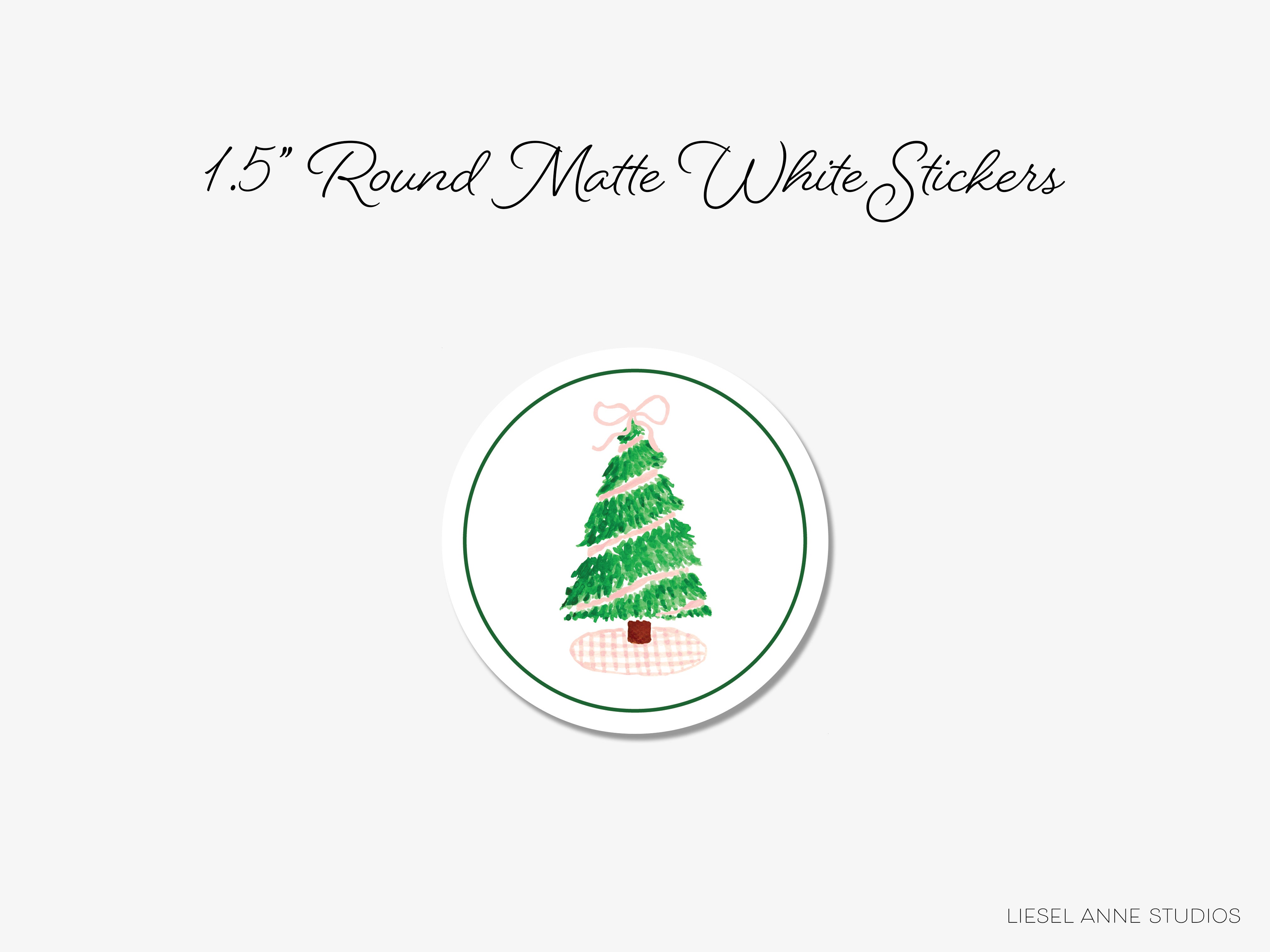 A round white sticker with a Christmas tree design.