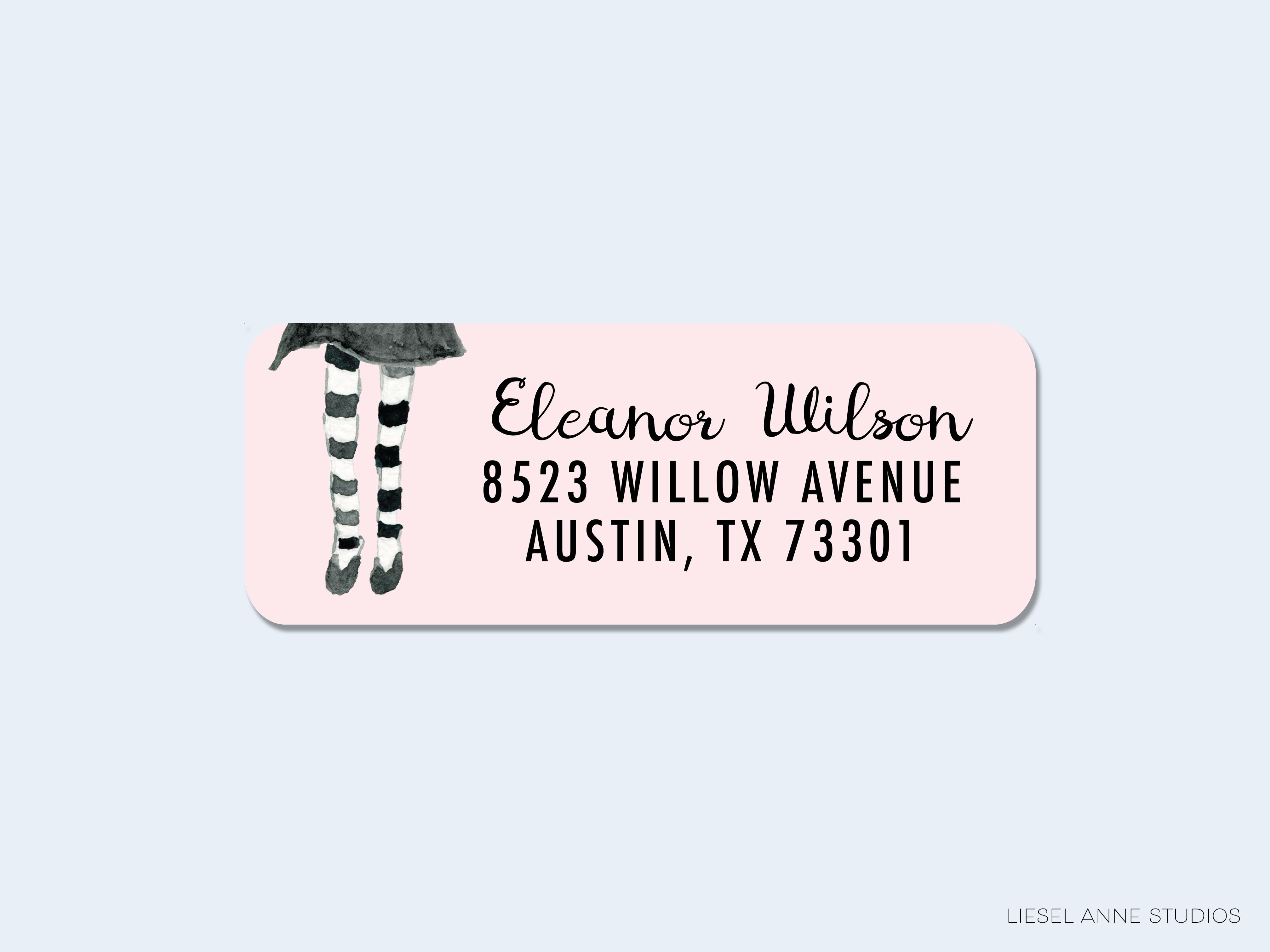 A pink envelope label with the name "Eleanor Wilson" and address "8523 Willow Avenue Austin, TX 73301".
