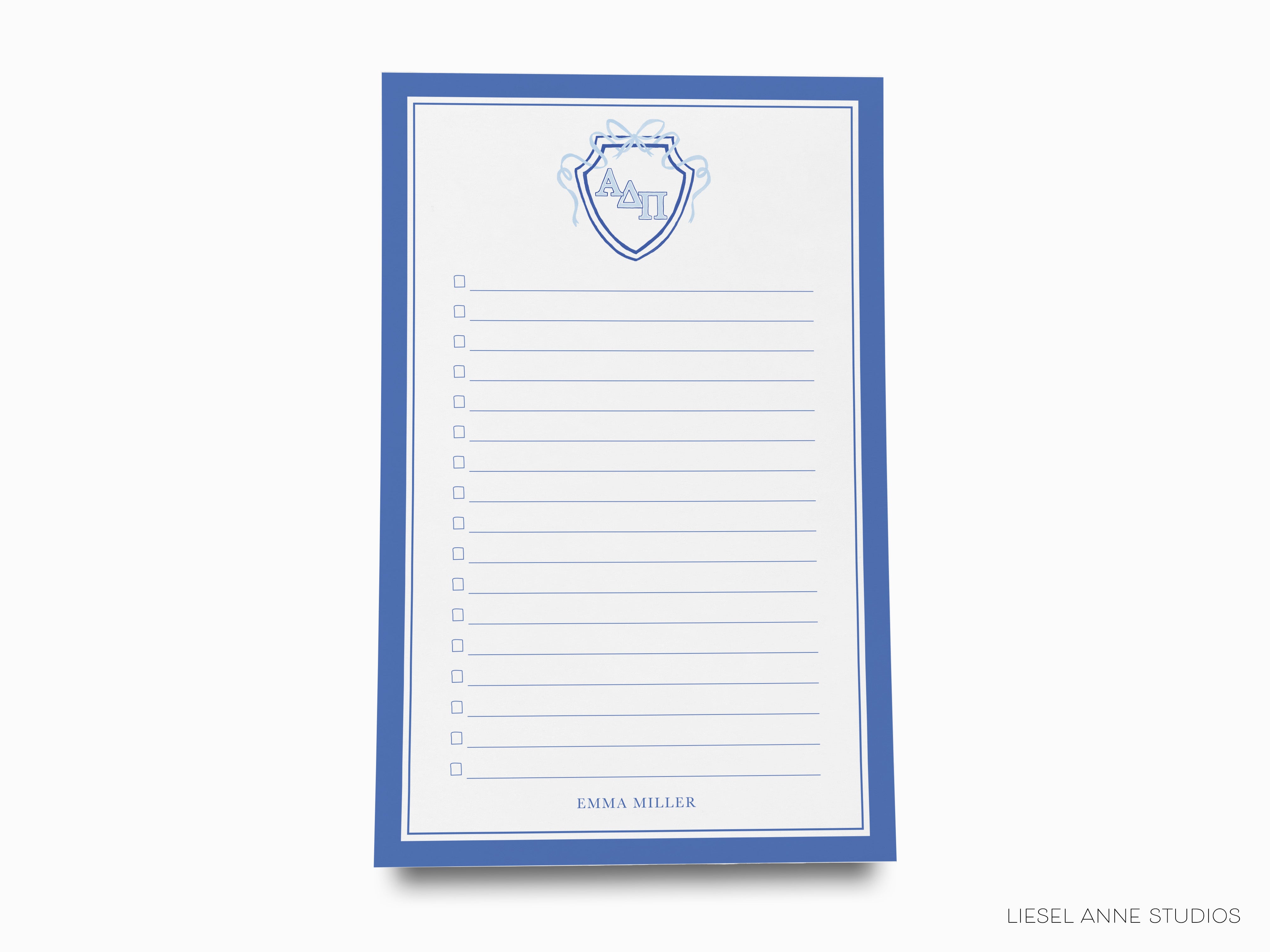 a notepad with a picture of a shield on it