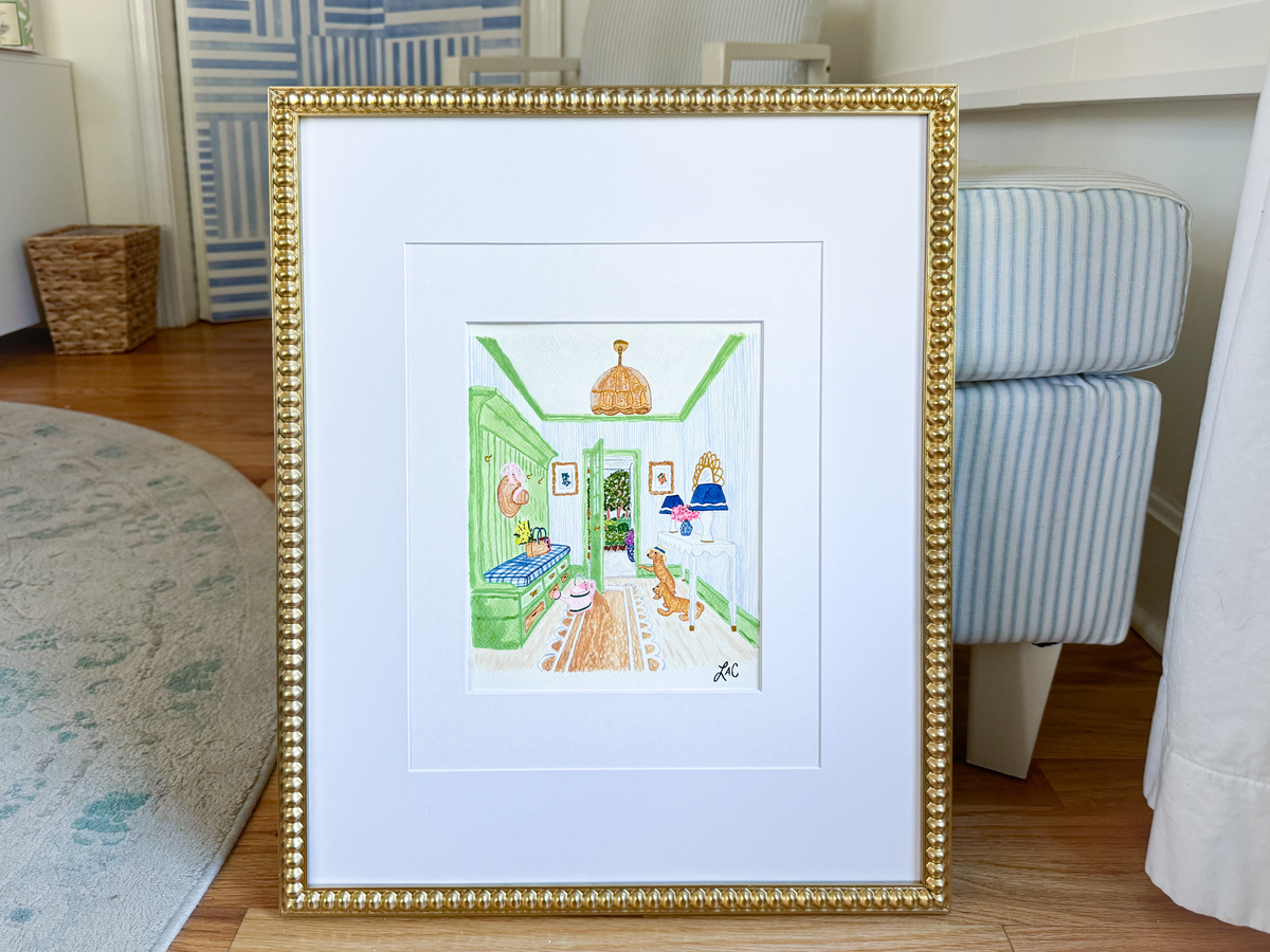 a framed illustration of a kitchen scene with a green door, a sink, and a dog.
