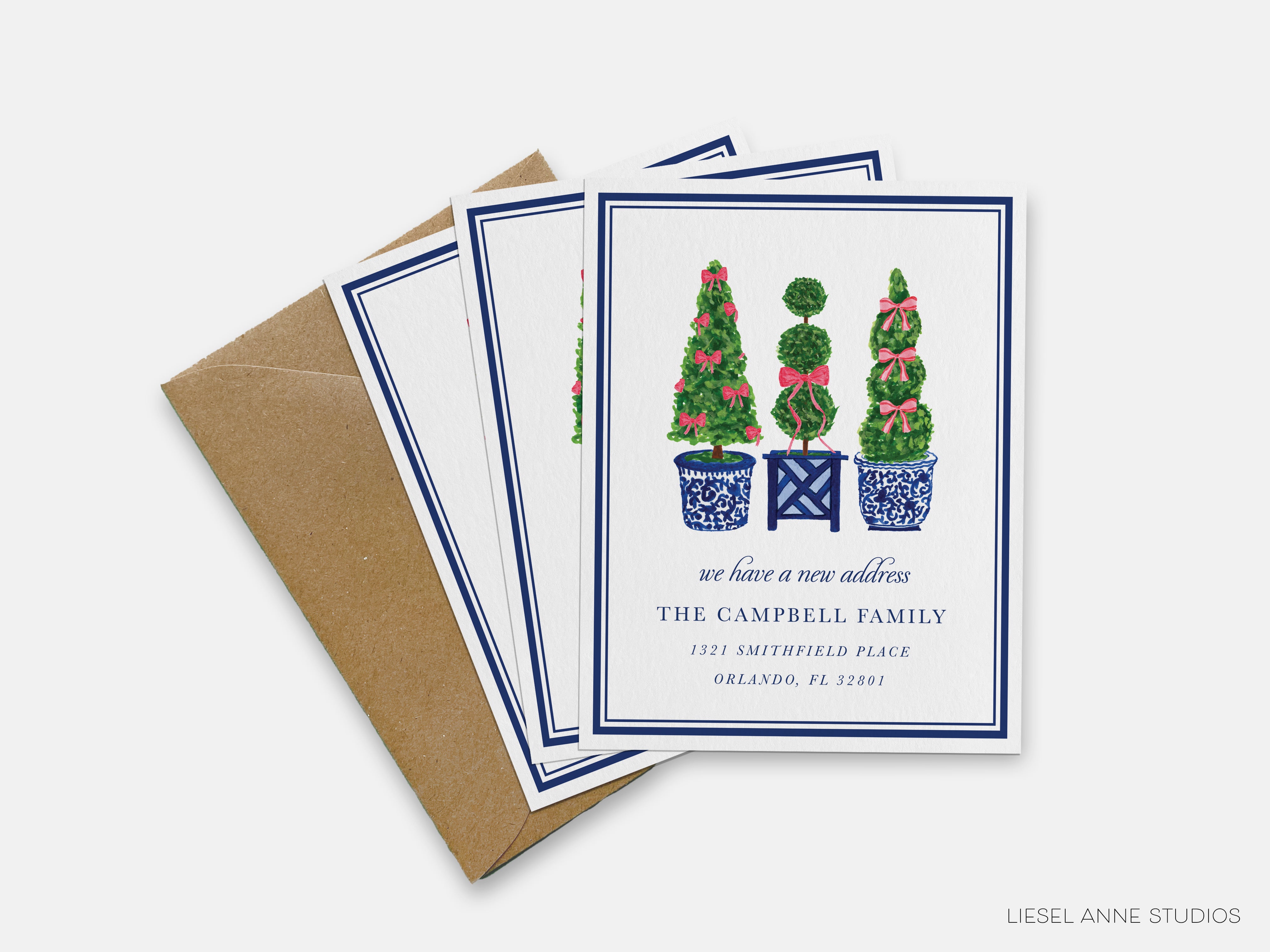 A set of greeting cards featuring a design of three topiary trees in blue and white pots, with a note that reads "we have a new address THE CAMPBELL FAMILY 1321 SMITHFIELD PLACE ORLANDO, FL 32201".