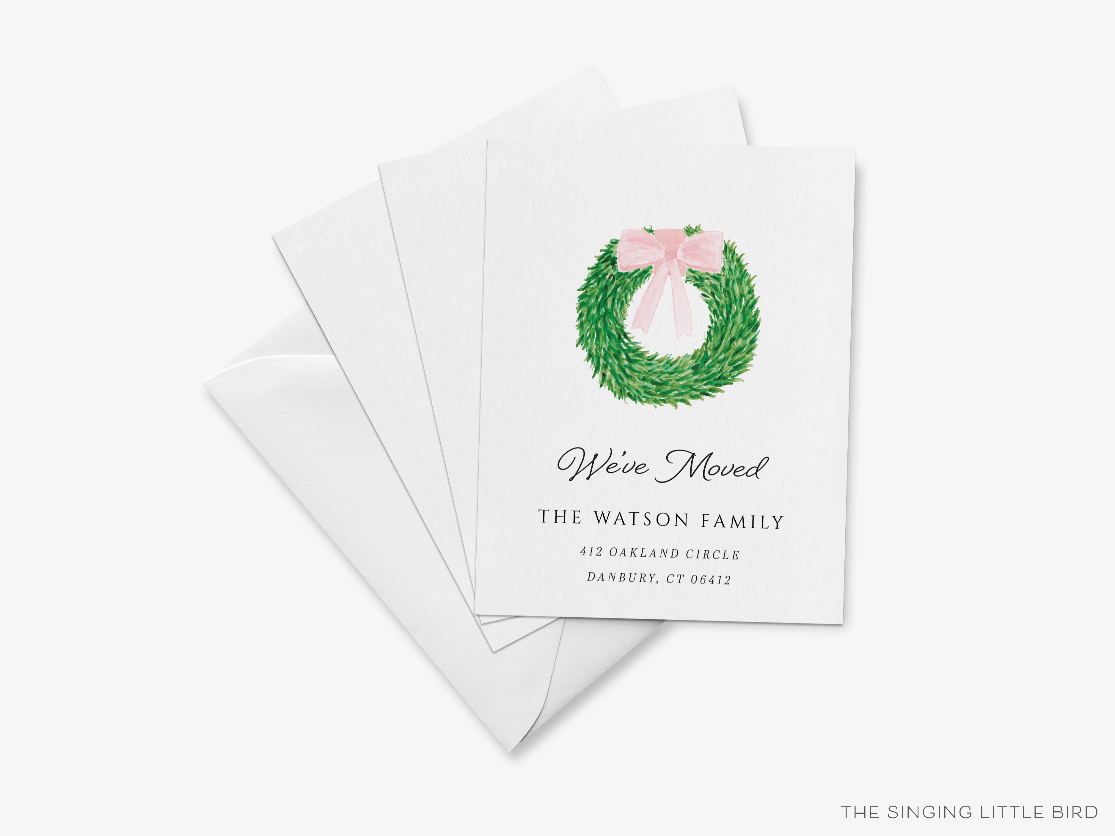 Wreath with Pink Bow Moving Announcement-These personalized flat change of address cards are 4.25x5.5 and feature our hand-painted watercolor wreath with a bow, printed in the USA on 120lb textured stock. They come with your choice of envelopes and make great moving announcements for the greenery lover.-The Singing Little Bird