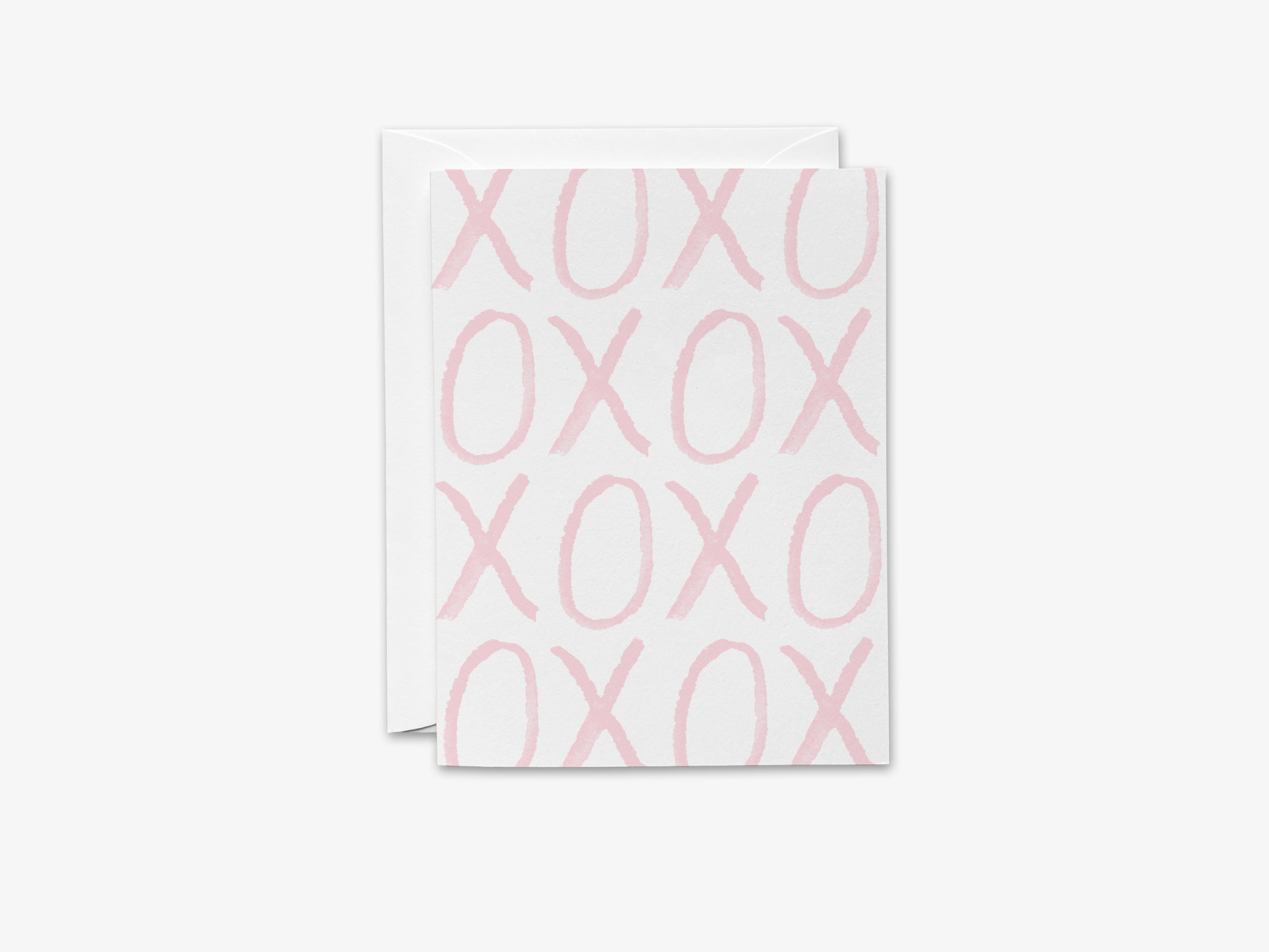 XOXO Pink Bold Greeting Card-These folded cards are 4.25x5.5 and feature our hand-painted watercolor xoxo, printed in the USA on 100lb textured stock. They come with a White envelope and make a great card for the special one in your life.-The Singing Little Bird